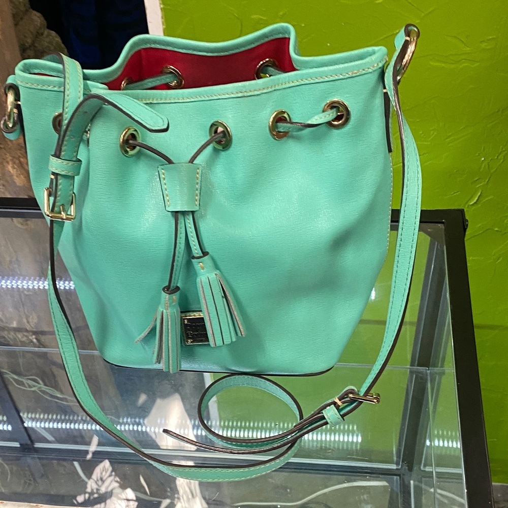 Turquoise  Dooney and Bourke Bucket Bag! Very good condition, drawstring closure
